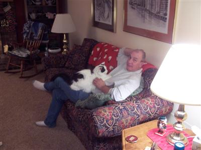 Sandy's son husband Phil & their cat Busto